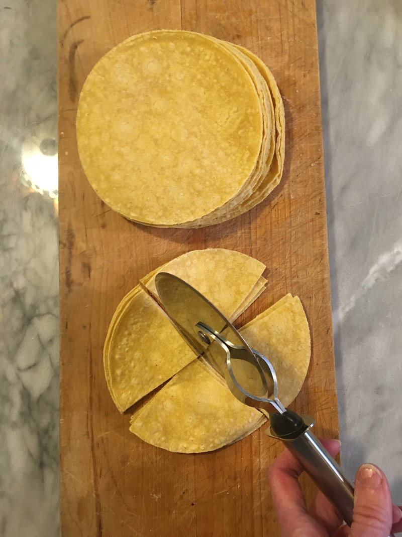 Cutting tortilla chips with a pizza cutter