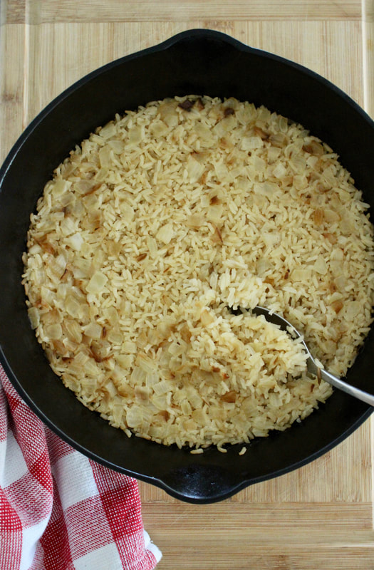 Iron skillet of onion baked rice