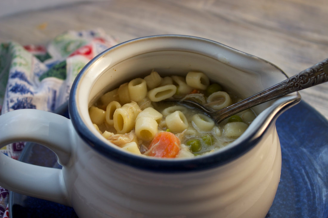 Cup of yummy turkey noodle soup