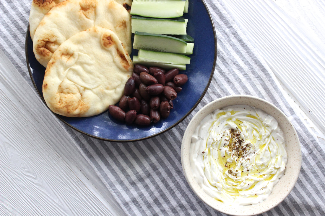 Labneh with naan, cucumbers and olives