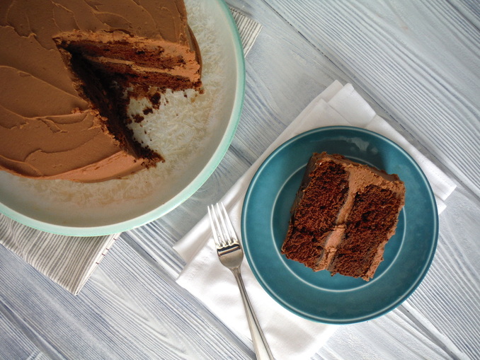 Enjoy a delicious slice of chocolate cake with a glass of milk.