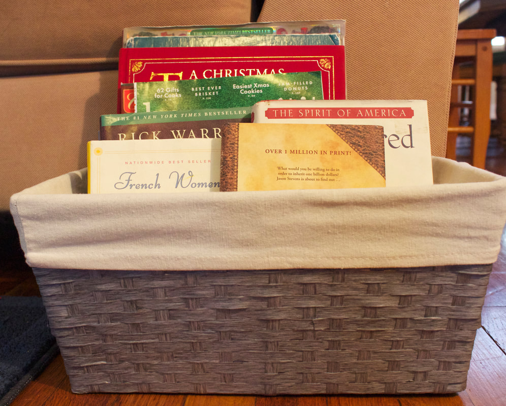 Set out a pretty basket with light reading material to entertain your guests.