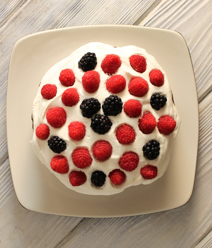 Berries and Cream Cake dotted with berries