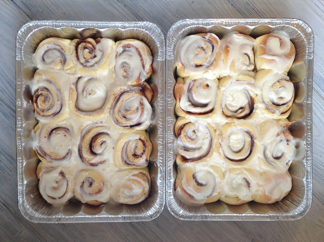 Large pans of bread machine cinnamon rolls perfect for a potluck or bakesale