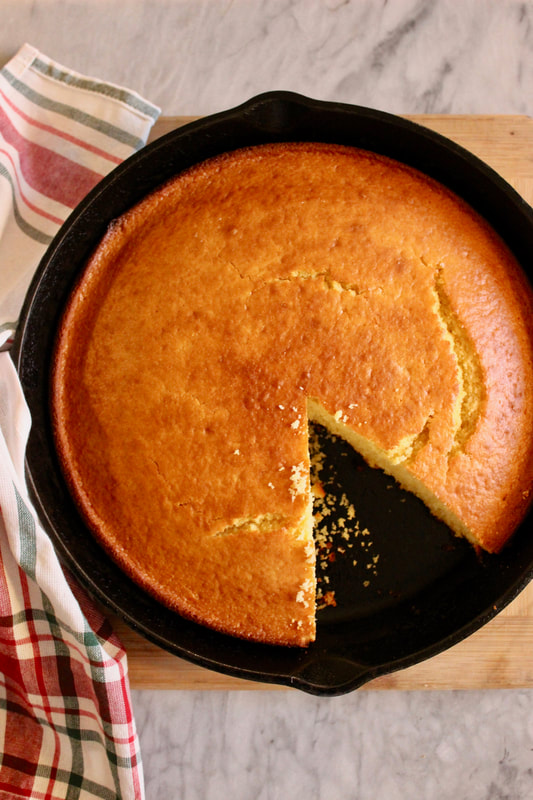 Iron Skillet Honey Corn bread with a slice cut out