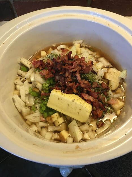 Slow cooker with potato soup