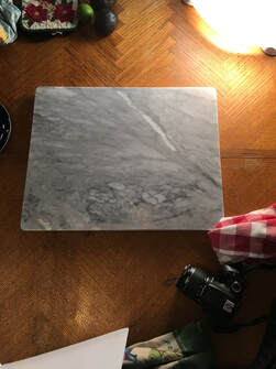 Marble board as background for overhead food photography