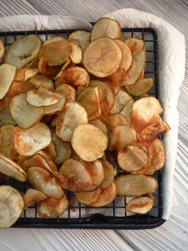 Homemade potato chips on cooling rack