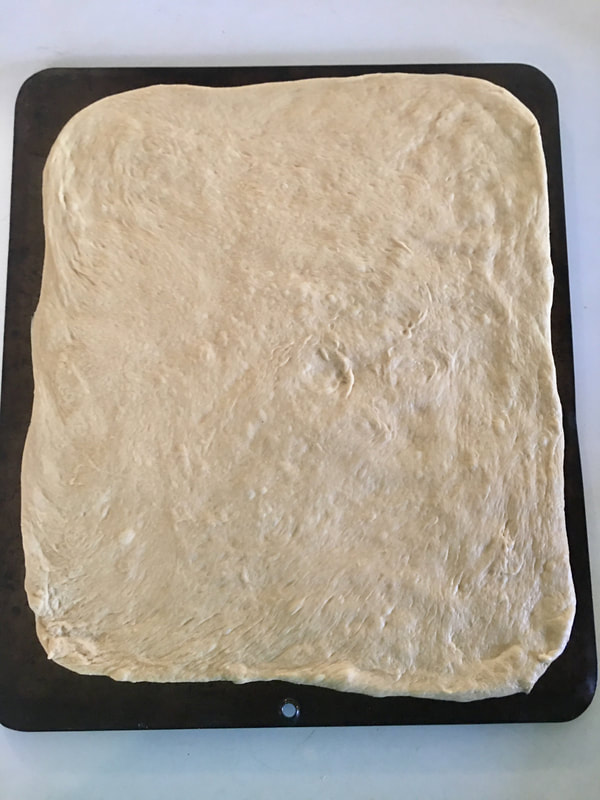 Rolled out dough on a baking sheet