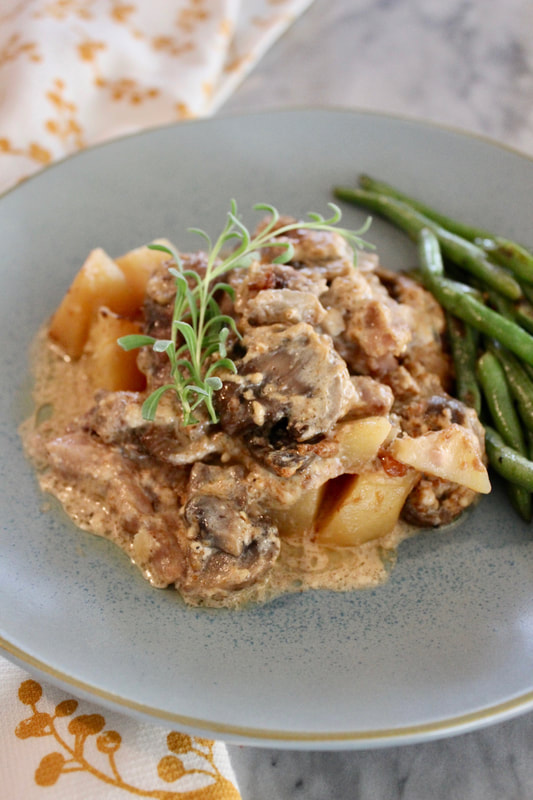 Slow Cooker Pork Chops in Cream Sauce with Potatoes and Mushrooms