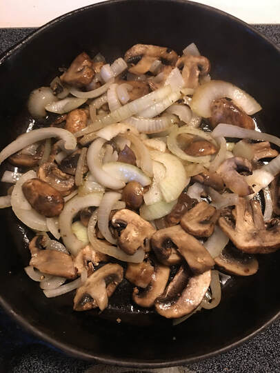 sauteed mushrooms and onions in skillet