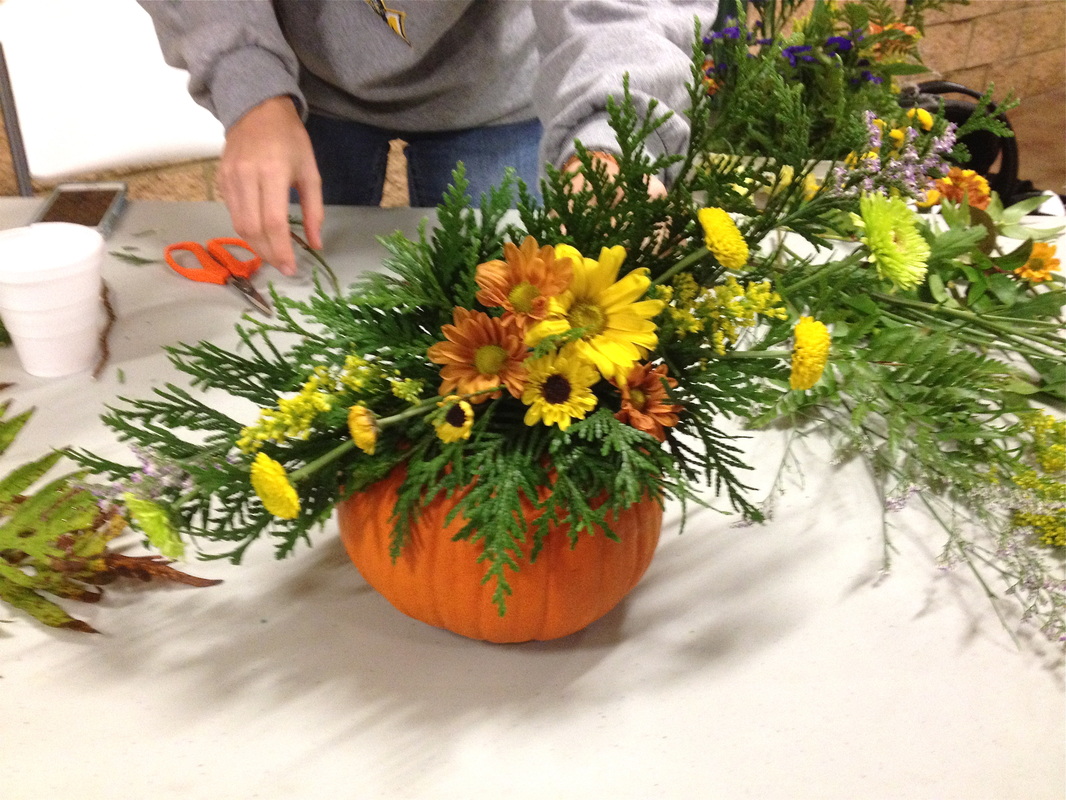 Spray design pumpkin floral arrangement