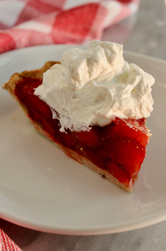 Strawberry pie slice with whipped cream